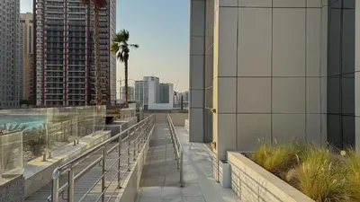 a balcony with a view of a city at Skyline View Stu 20th Floor Regina Tower, JVC in Dubai