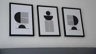 four framed pictures of a woman on a wall at Creek Vista Elegance-1BRBurj Khalifa View in Dubai