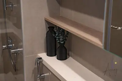two black vases sitting on a shelf in a bathroom at Luxe Desiged Stu Dubai Marina Dream LIV Marina in Dubai