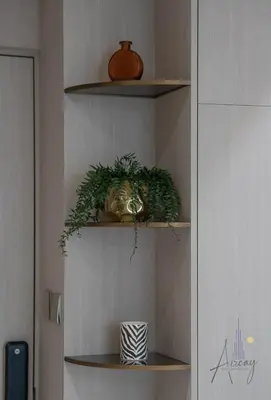 a shelf with plants on it in a room at Cosy Corner 1BR Designer Apt Luxe Nest in JVC in Dubai