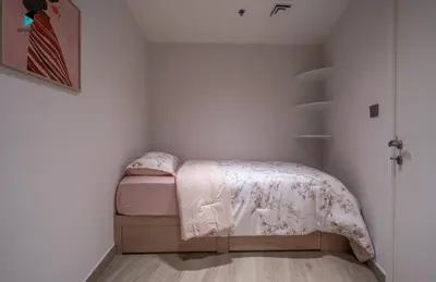 a small bedroom with a bed in a room at Modern Marina-View 3 BR Prime Waterfront in Dubai