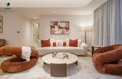 a living room with a couch and a table at Modern Marina-View 3 BR Prime Waterfront in Dubai