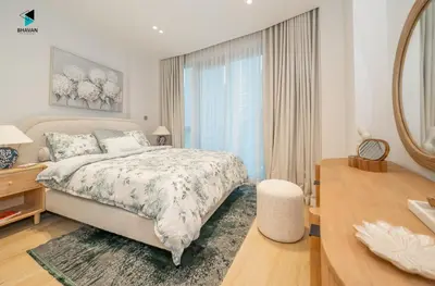 a bedroom with a bed and a large window at Modern Marina-View 3 BR Prime Waterfront in Dubai