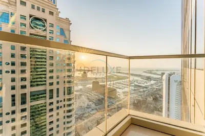 a balcony with a view of a city at 3BR with Sea View, Short Stroll From Marina Walk and JBR Beach, With Easy Access to Tram and Metro - Ocean Heights, Dubai Marina by Deluxe Holiday Homes in Dubai