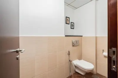 a bathroom with a toilet in a room at The Jewel Tower 2 in Dubai