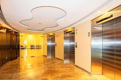 a hallway with elevators in a building at The Jewel Tower 2 in Dubai