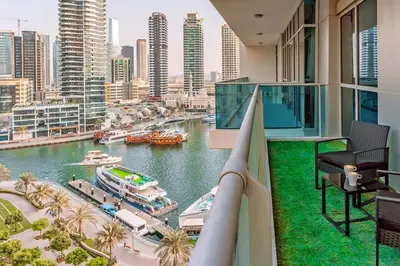 a balcony with a view of a river and buildings at The Jewel Tower 2 in Dubai
