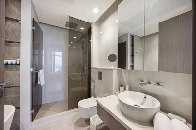 a bathroom with a sink and a toilet and a shower at 833keys - 1BR - Waterfront Stay - Business Bay in Dubai