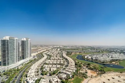 an aerial view of a city with tall buildings at Brand New 1BR - Infinity Pool & Golf Views in Dubai