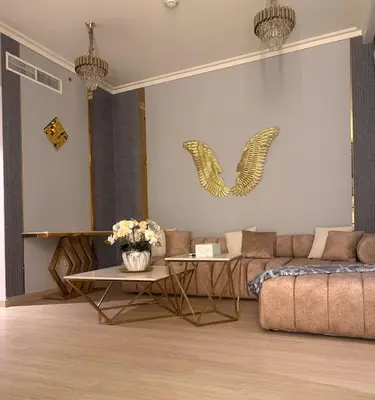 a living room with a couch and a table at Central Downtown 1BR - Walk to Dubai Mall in Dubai
