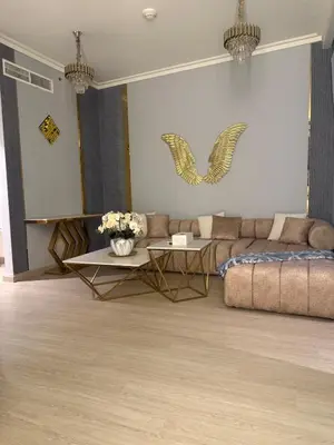 a living room with a couch and a table at Central Downtown 1BR - Walk to Dubai Mall in Dubai