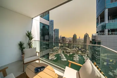 an apartment balcony with a view of the city at Luxe 2BR Maid High Floor LIV Marina Dream in Dubai