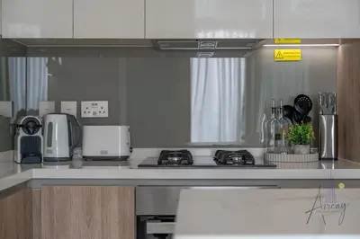 a kitchen with a stove and a counter top at Luxe Missoni-Inspired 1BR Sky-High Living in Dubai