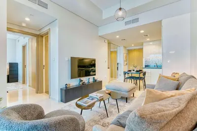 a living room with a couch and a table at PVH - City View Contemporary 2BR - Aykon Tower C in Dubai