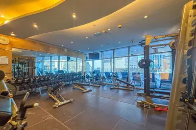 a gym with rows of chairs in a building at Frank Porter - Ocean Heights, Dubai Marina in Dubai