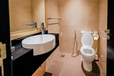 a bathroom with a toilet and a sink at Escape24 2BR with Large Balcony near Burj Khalifa in Dubai