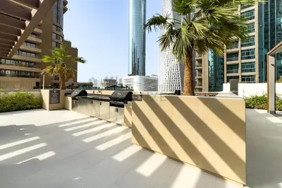 a view of a city with palm trees and buildings at Luxury 1BR with Pool and Stunning Marina Views, Perfectly Located Minutes from the Beach, Tram, and Mall, LIV Marina, Dubai Marina by Deluxe Holiday Homes in Dubai