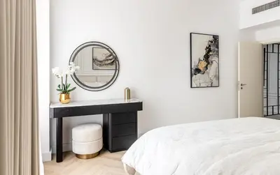 a white bedroom with a sink and a mirror at Stylish 1 Bedroom Apartment with Marina View JBR in Dubai