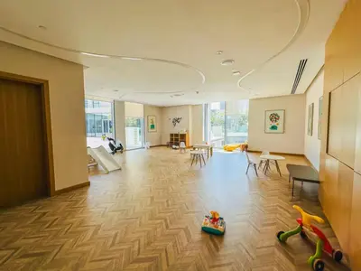 a large room with a room with a room with toys on the floor at Vogue Creek Harbour Icon Bay Waterfront Living Close to Downtown, Burj Khalifa and Dubai Mall, Two Bedroom Apartment with Large Balcony and Canal View, Access to all Amenities in Dubai