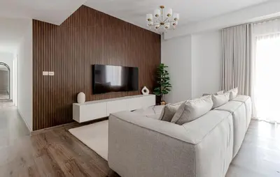 a living room with a couch and a tv at Beautiful 2 bed in JBR! bahar in Dubai