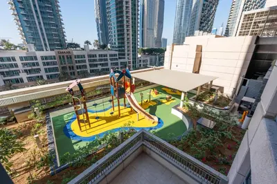 an aerial view of a playground in a city at 1 BR Near Burj Khalifa & Dubai Mall - Downtown in Dubai