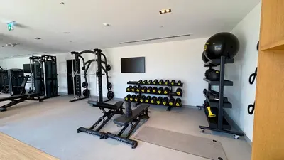 a gym with a lot of equipment in a room at Great 1 bed apart close to Burj Khalifa and Dubai Mall in Dubai