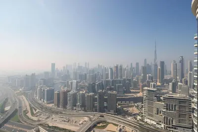 an aerial view of a city with tall buildings at Frank Porter - Paramount Tower A in Dubai