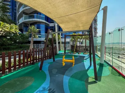 a playground in a building with a yellow swing at Frank Porter - Paramount Tower A in Dubai