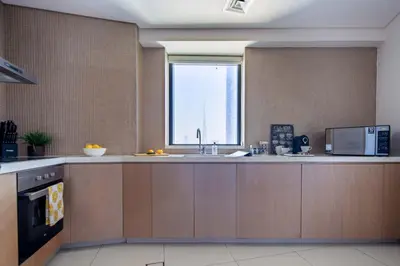 a kitchen with a sink and a window at Frank Porter - Paramount Tower A in Dubai