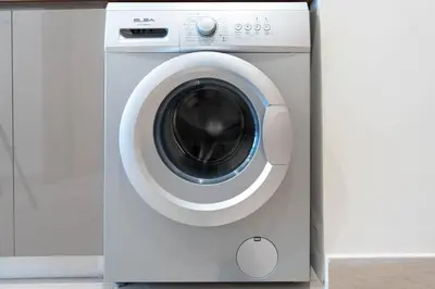 a white washing machine with its door open at Modern Studio in Azizi Riviera 46 with Pool, Gym & Free Parking in Dubai