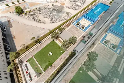 an overhead view of a building with a swimming pool at Elegant 1BR Apartment at DAMAC Vera in Business Bay in Dubai