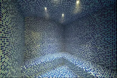 a blue tiled bathroom with a tub in a room at Elegant 1BR Apartment at DAMAC Vera in Business Bay in Dubai