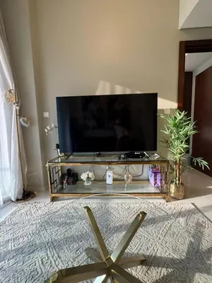a living room with a large flat screen tv at Elegant 1BR Apartment at DAMAC Vera in Business Bay in Dubai