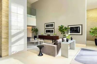 a living room with a couch and a table at Palm Jumeirah, Fancy 2 Bedroom suite! in Dubai
