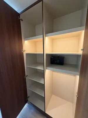 a walk in closet with a glass door at Magical Views Downtown Lux 2 BR Urban Resort in Dubai