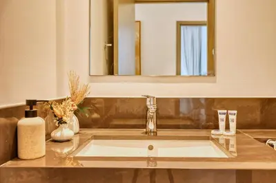 a bathroom with a sink and a mirror at PVH - Serene Central 2BR - Creek Horizon in Dubai