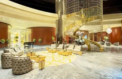 a large lobby with a grand piano and furniture at EEHH 1BR - 8 day NYE festival - Paramount - for 4 in Dubai