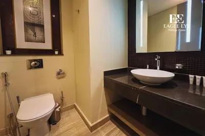 a bathroom with a white toilet and a sink at EEHH 1BR - 8 day NYE festival - Paramount - for 4 in Dubai