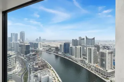 a view of a city with a river and buildings at Beautiful unit with canal view ! DAMAC PRIVE in Dubai