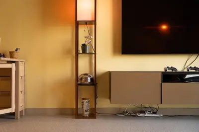 a living room with a tv on the wall at Meydan Boutique Loft Near Downtown in Dubai