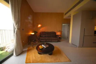 a living room with a couch and a coffee table at Meydan Boutique Loft Near Downtown in Dubai