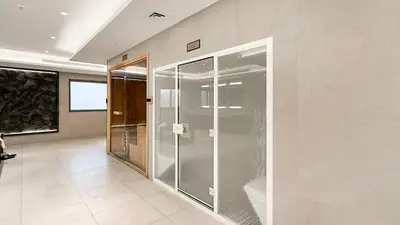 a bathroom with a glass shower in a room at Enjoy 8-Day NYE Spectacles with Burj Khalifa View in Dubai
