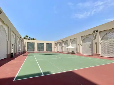 a tennis court in the middle of a building at VayK - Stylish 1BR in Palm Jumeirah with Secluded Beach Access in Dubai