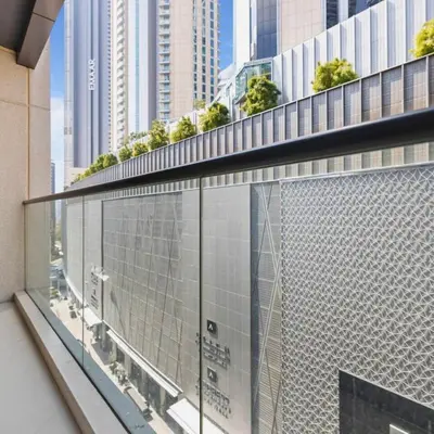 a balcony with a view of a city at Heart of Downtown Luxury 1BHK Dunya in Dubai