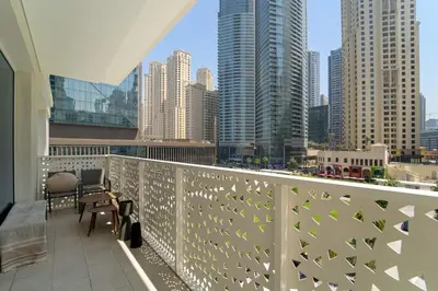 a balcony with a view of a city skyline at VayK - Feel the Festive Vibe in Cozy 1BR with Beach Access in Dubai