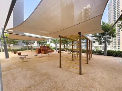 a pavilion with a canopy with benches and a playground at VayK - Iconic 1BR in Downtown in Dubai