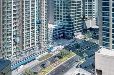 an overhead view of a city with tall buildings at Stylish Stay at DAMAC Maison Cour Jardin Canalview in Dubai