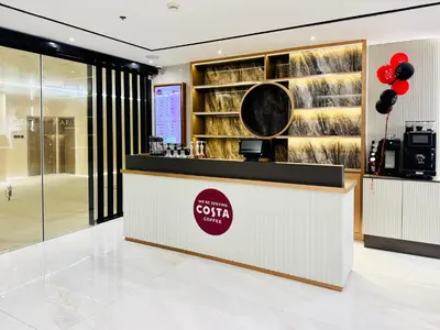 a lobby of a coffee shop with red balloons at Luxury Studio Apartment Near Jumeirah Beach in Dubai