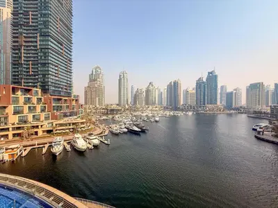 a view of a city with boats in the water at GuestReady - 2BR l Marina View + Infinity Pool in Dubai