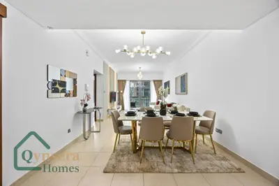 a dining room with a table and chairs at Skyline Bliss Luxury Apartment Dubai in Dubai